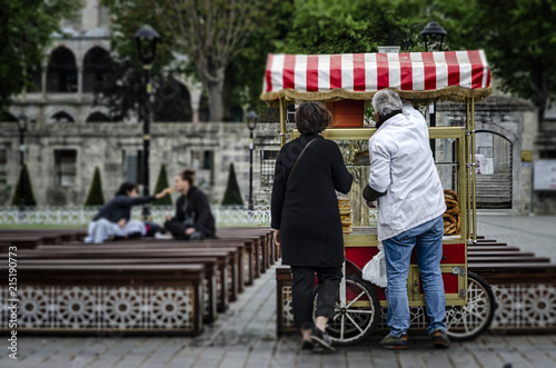 Photography Street seller of fast food with bagle and simit on traditional turkish cart at S