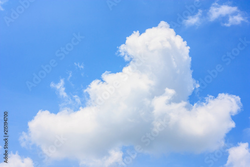 Fluffy cloud against blue sky background