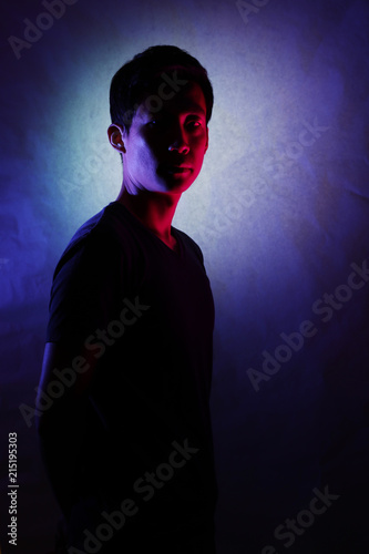 Silhouette of a man deep in thought. A side view of a person who is seriously concerned.