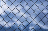 Wire fence or metal mesh, rabitsa, view of the sky.