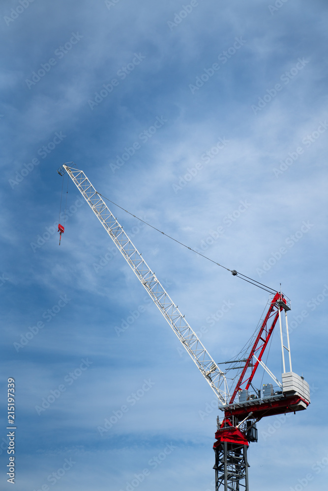 Red Crane Against Blue Sky at Construction Site Red Crane Against Blue Sky at Construction Site