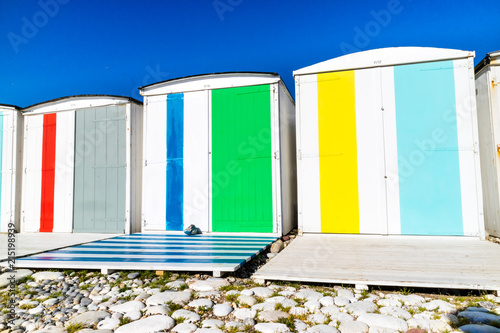 Traditional changing rooms on the beach photo