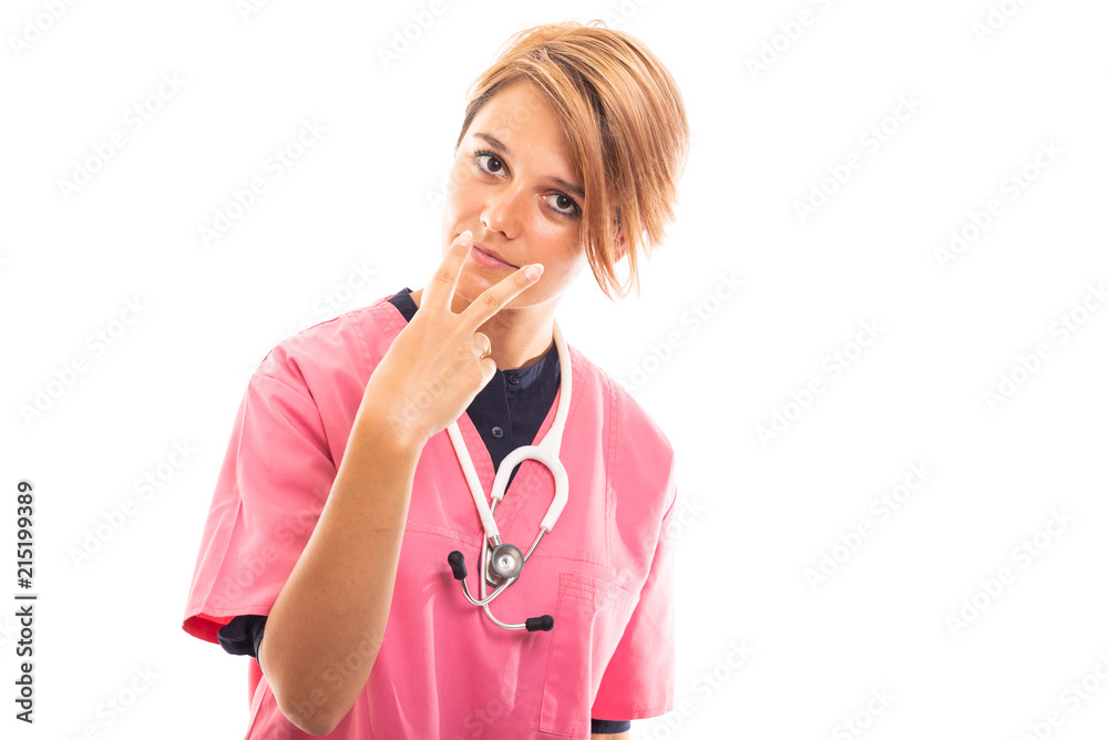Female vet wearing pink scrub showing watching you gesture. Female vet wearing pink scrub showing watching you gesture.