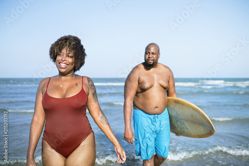 Happy couple playing in the sea