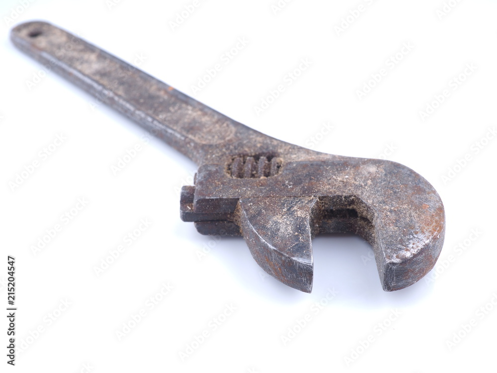 old adjustable wrench on white background old adjustable wrench on white background