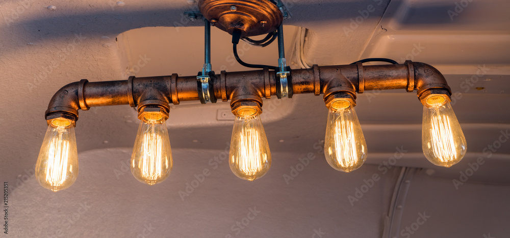 Industrial design chandelier in trendy copper.Cyberpunk ceiling lamp. Stock  Photo | Adobe Stock