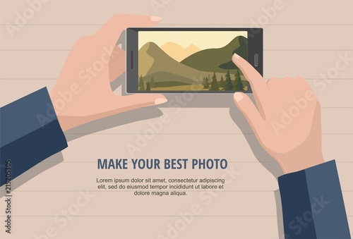 Mobile photography concept. Man looking photos of nature landscape to phone. Isolated on wooden background.
