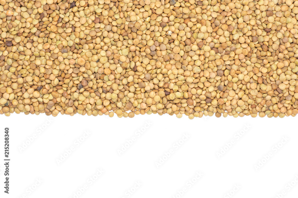 Lot of whole raw green lentil seeds above in line flatlay isolated on white Lot of whole raw green lentil seeds above in line flatlay isolated on white