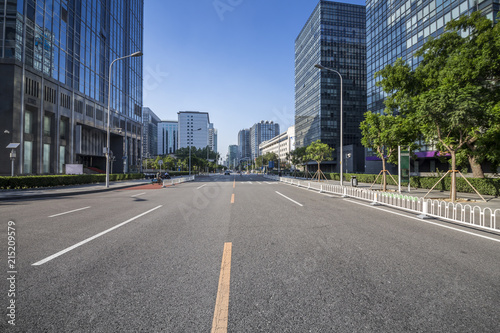 Panoramic skyline and modern business office buildings with empty road empty concrete square floor