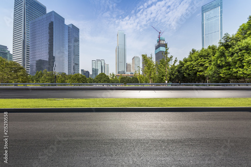 Panoramic skyline and modern business office buildings with empty road empty concrete square floor