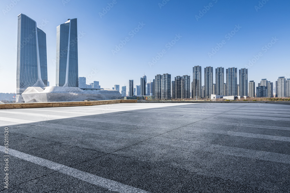 Panoramic skyline and modern business office buildings with empty road,empty concrete square floor