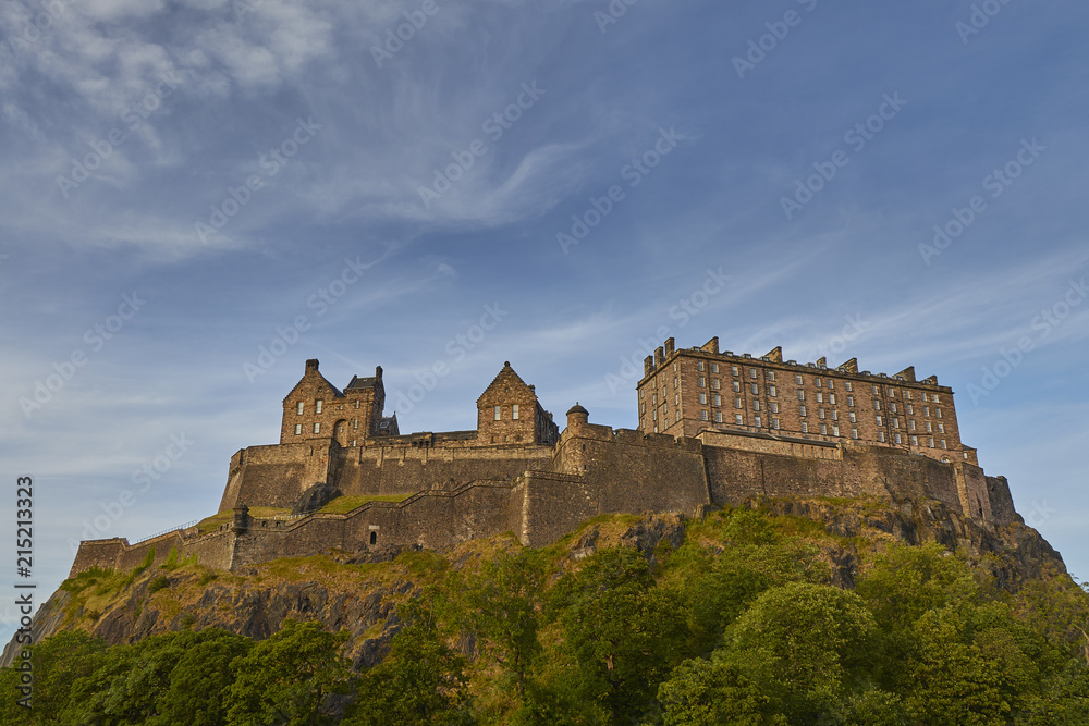 Ancient Edinburgh Castle on rocky mountain with beautiful sky background, Scotland, United Kingdom.