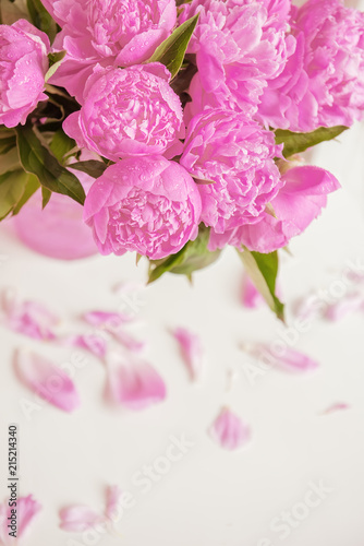 Bouquet of delicate pink peony flowers on a light background. 
