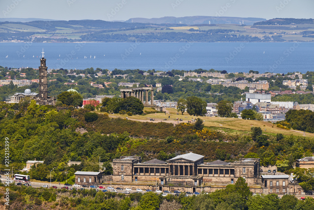 Naklejka premium View of Calton Hill from Holyrood Park with beautiful blue sky in Edinbourgh, Scotland, United Kingdom.