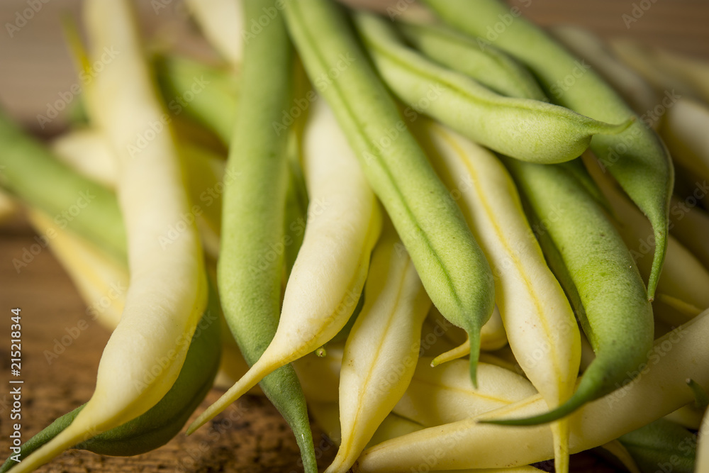 Fresh raw beans on a wooden background Fresh raw beans on a wooden background
