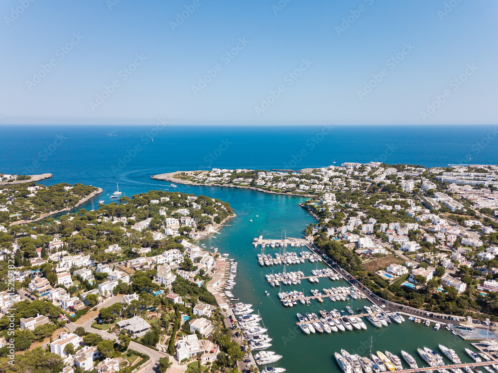 Aerial: Jetty of Cala D'Or resort town in Mallorca, Spain