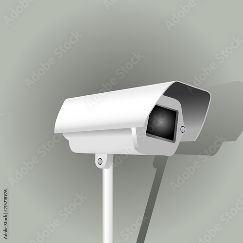 Surveillance camera on grey background - security camera