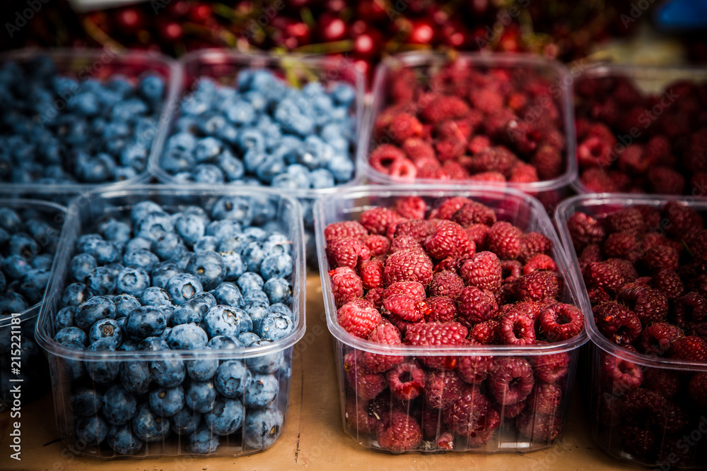 Berries on market stall / Blueberries, raspberries and cherries on marketplace Berries on market stall / Blueberries, raspberries and cherries on marketplace