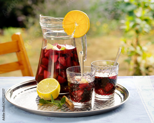Canvas Print Refreshing homemade sangria with summer fruits in pitcher and glasses