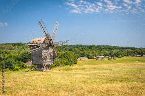 Old wood windmill on a summer day