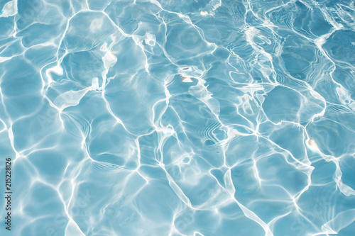 Texture of water in swimming pool for background