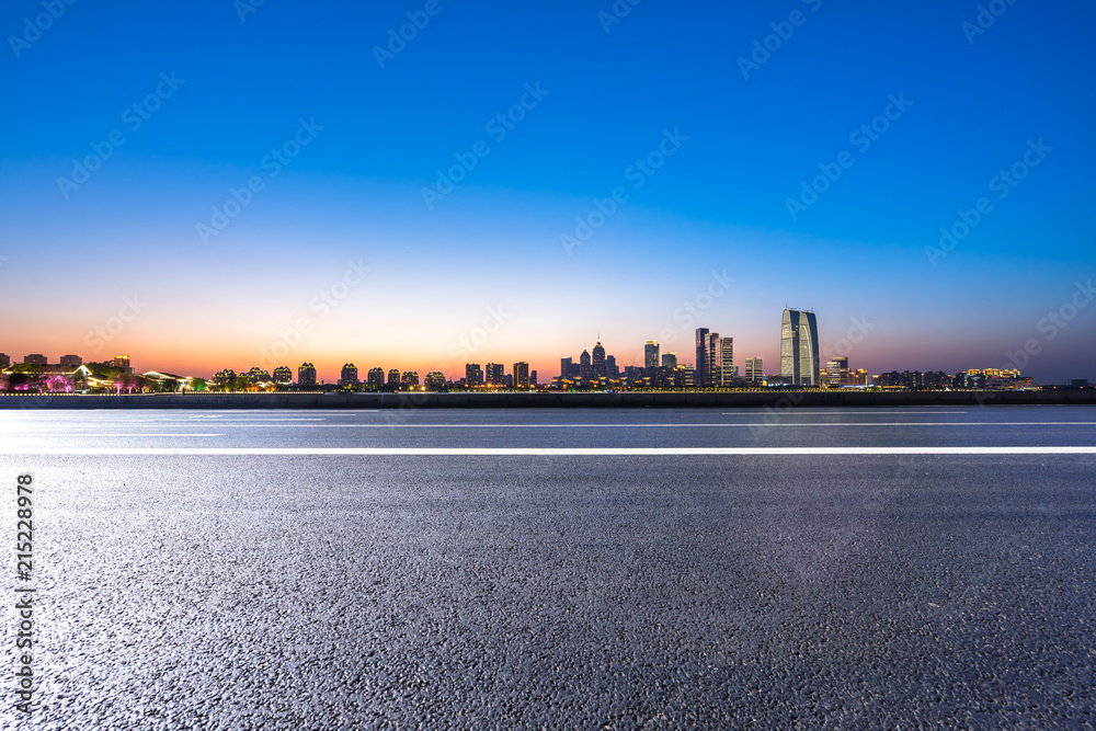 city skyline with asphalt road in urban