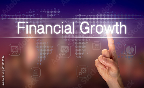 A hand selecting a Financial Growth business concept on a clear screen with a colorful blurred background.