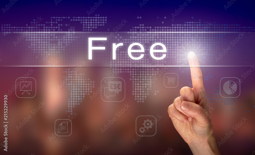 A hand selecting a Free business concept on a clear screen with a colorful blurred background. A hand selecting a Free business concept on a clear screen with a colorful blurred background.