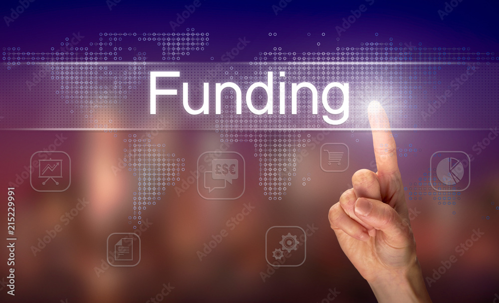 A hand selecting a Funding business concept on a clear screen with a colorful blurred background.