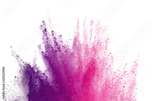 Abstract of colored powder explosion on white background. Freeze motion of purple powder exploding on white background. Colored cloud. Colored dust.