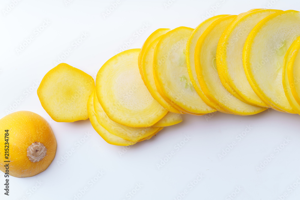 Sliced summer yellow squash on white background Sliced summer yellow squash on white background
