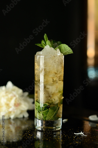 mohito (Mojito) drink coctail lemon ice fresh mint on table black background