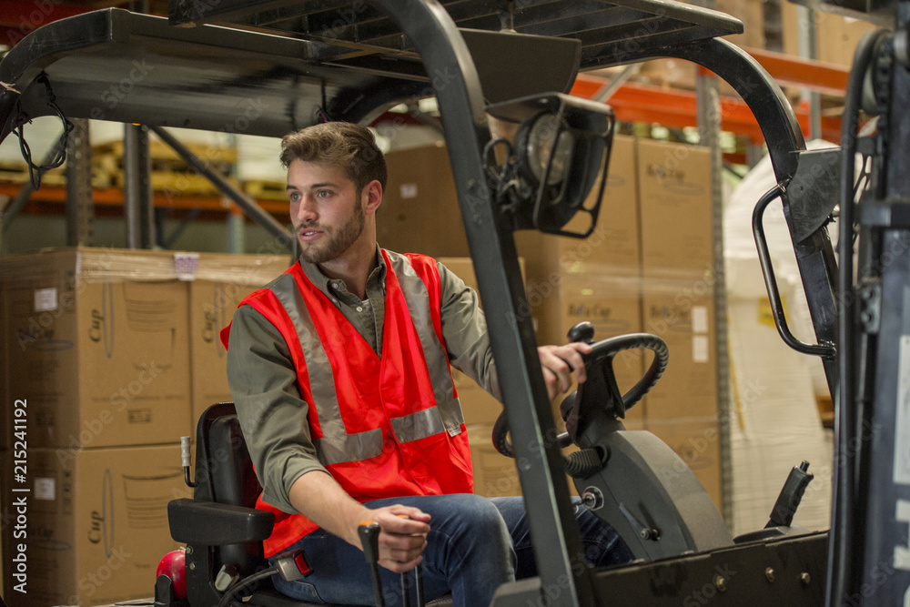 Worker operating forklift truck Worker operating forklift truck