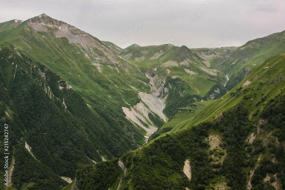 Naklejka premium river and waterfall in high mountains
