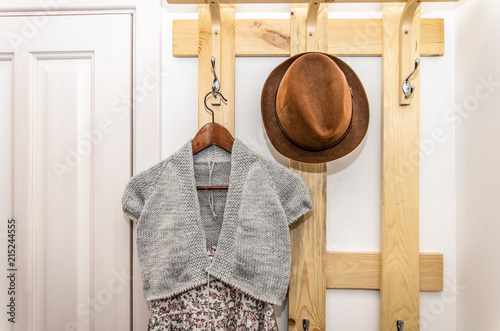 Summer clothes hanging on a hanger in a bright hallway