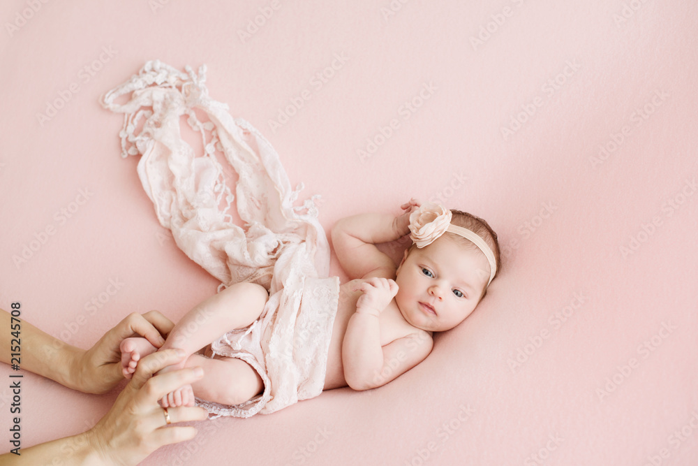 Newborn girl on a pink background. Photoshoot for the newborn. 7 days from  birth. A portrait of a beautiful, seven day old, newborn baby girl Stock  Photo | Adobe Stock