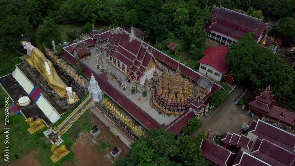 Aerial View of Buddhist Temple Wat Phra That Suthon Mongkon Khiri features beautiful architectures that are inspired by the ancient, traditional ordination hall (Ubosot) and reclining Buddha statue
