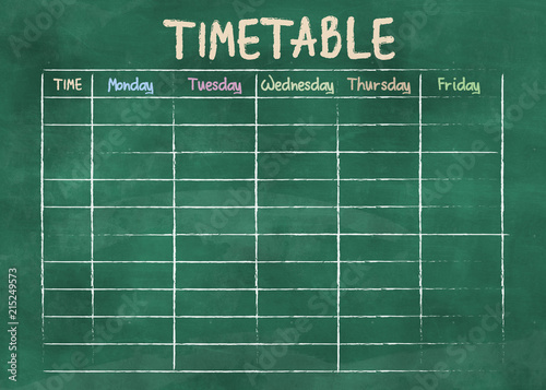 school timetable or class schedule on green classroom chalkboard photo