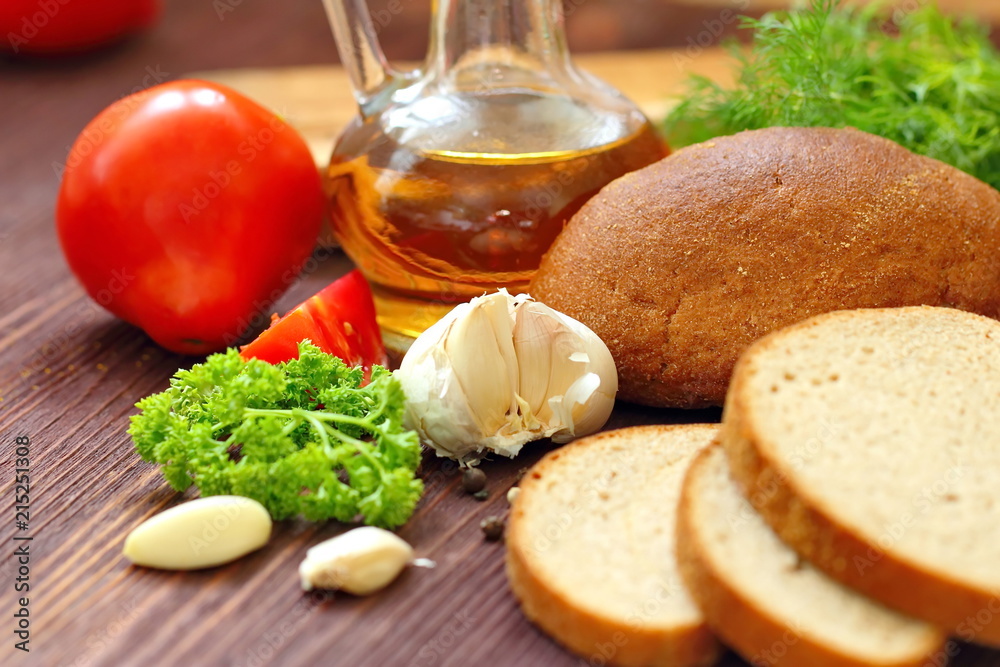 Variety of organic food including vegetables, spices, oil and bread Variety of organic food including vegetables, spices, oil and bread