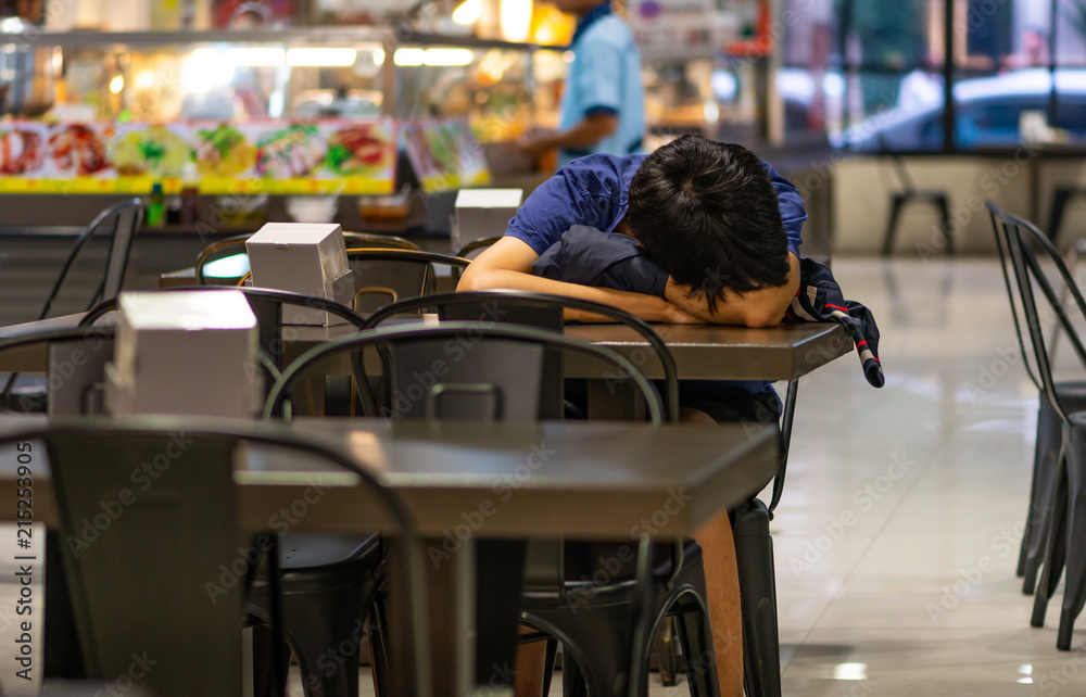 Tired young man taking a nap