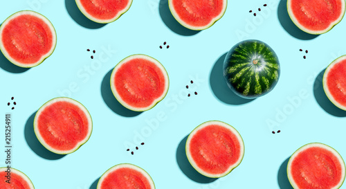 One out unique watermelons arranged on a blue background