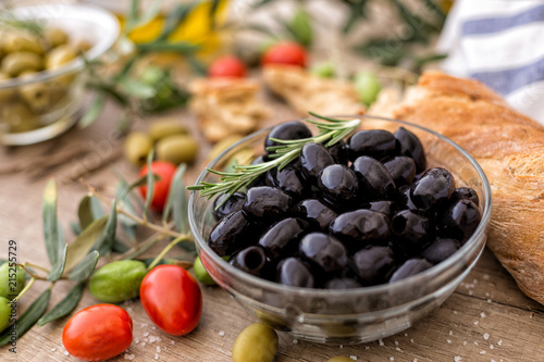 black olives in the bowl served for snack.