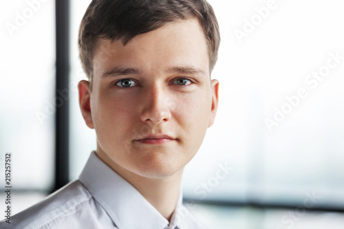 Portrait of young business man looking at camera. © Dmytro Panchenko