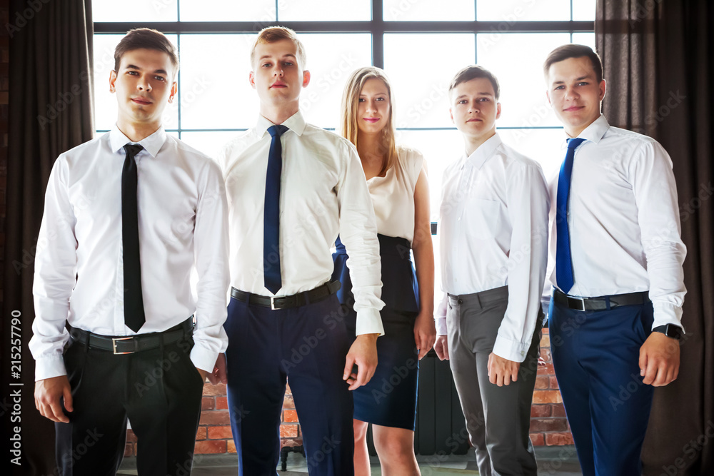Portrait of young business people looking at camera. Portrait of young business people looking at camera.