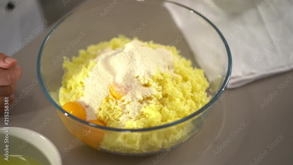 4K cooking detail putting ingredients in bowl for dough
4K cooking detail putting ingredients in bowl for dough