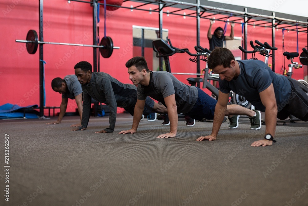 Athletes doing push up in the gym Athletes doing push up in the gym
