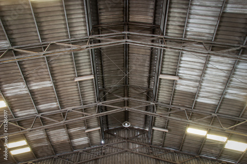 The ceiling of old warehouse with sport lights. lens flare. Texture background.