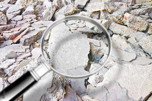 Obraz na plátne Looking for danger asbestos particles in industrial waste after demolishing a co