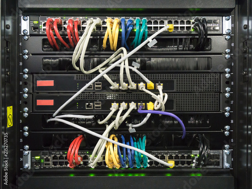 Detail of a communications rack, cables, switches and network