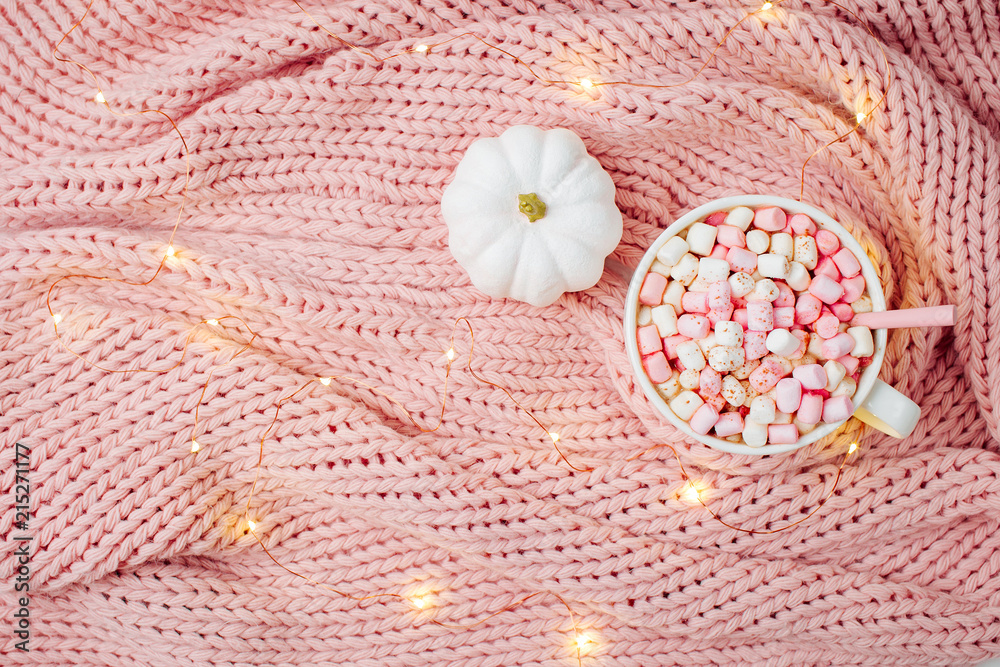 Pumpkin latte on bed with warm plaid. Copy space. Flat lay, top view Pumpkin latte on bed with warm plaid. Copy space. Flat lay, top view